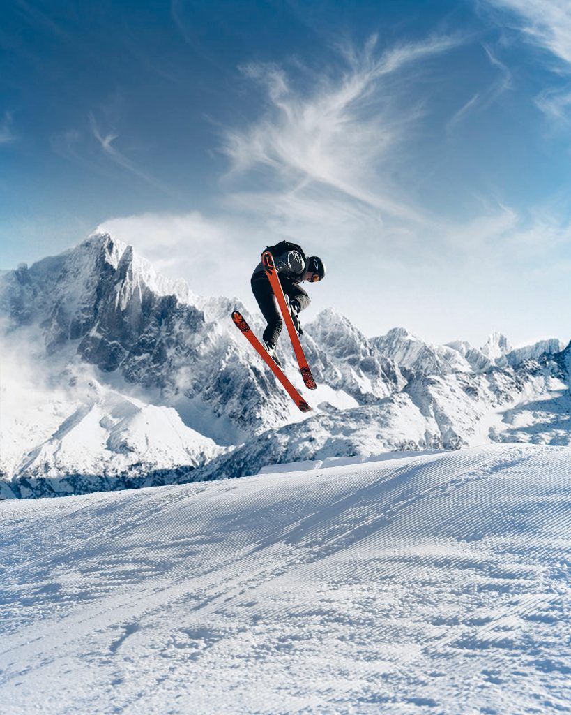 Skier descending a mountain piste, representing activities commonly covered by skiing holiday insurance.